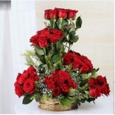 A Round Basket Arrangment Of 50 Red Roses (As Shown)