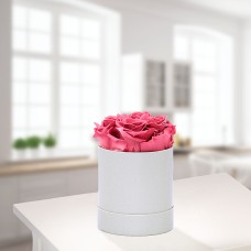 4 old pink roses in a hat box