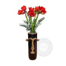 Amaryllis in a vase shaped like a face