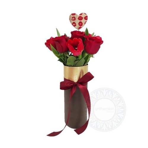 Special vase with red roses and tulips