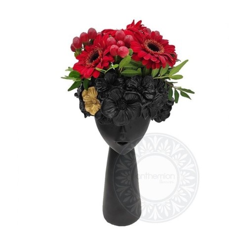 Black ceramic head with red flowers