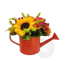 Charming watering can with flowers