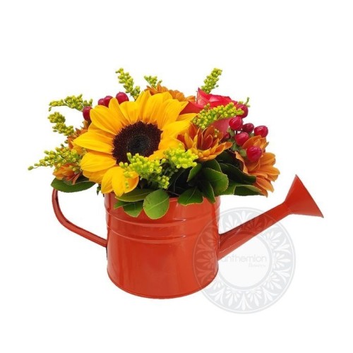 Charming watering can with flowers