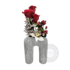 Embossed polyresin vase with flower composition
