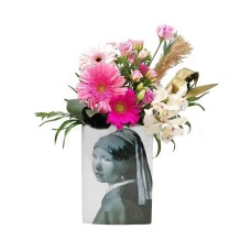 Pink floral arrangement in ceramic vase