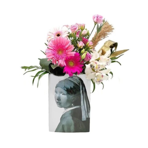 Pink floral arrangement in ceramic vase
