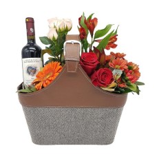 Flowers and wine in leather handbag