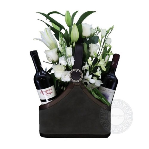 Black newspaper case with two wines and white flowers