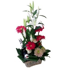Basket With Sparkling Wine And Flowers
