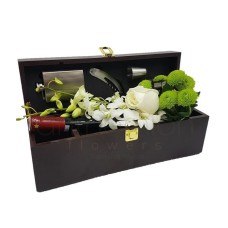 Flowers and wine in a gift box