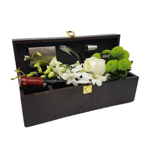 Flowers and wine in a gift box