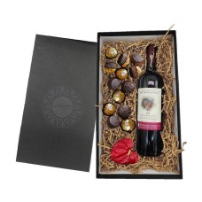 Gift box with red wine and chocolates