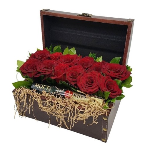 Chest with red roses and a Moet
