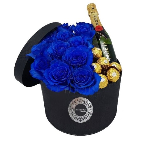 Blue roses in a box and a MOET
