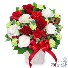arrangement of red roses and red ribbon