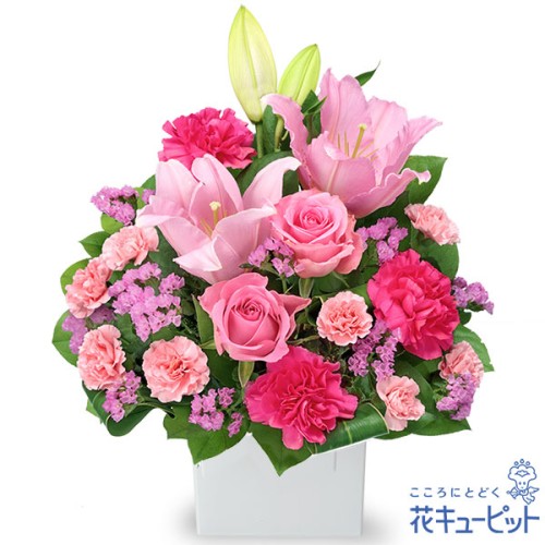 arrangement of lilies and pink roses