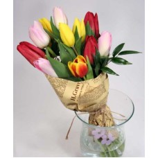 Colorful tulips in a paper funnel (L)