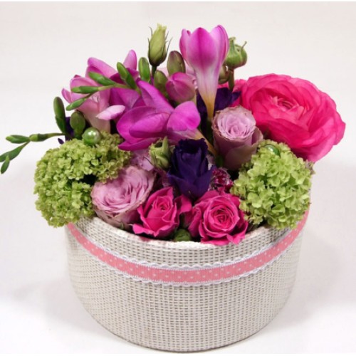 Spring flower box with freesias and roses