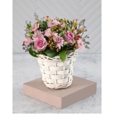 Pink And Purple Blooms In A White Basket