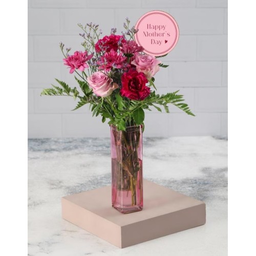 Purple Mothers Day Blooms In A Pink Vase