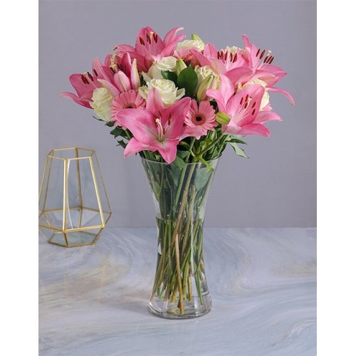 Pastel Seasonal Flowers In A Glass Vase