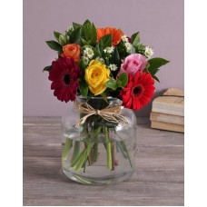 Mixed Flowers In A Glass Urn