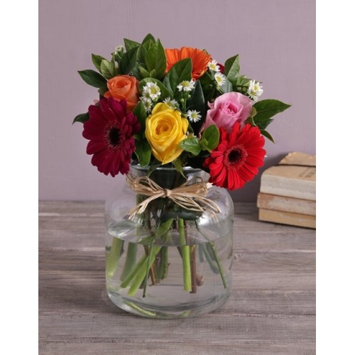 Mixed Flowers In A Glass Urn