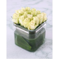 White Roses In Modern Square Vase