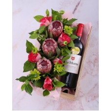 Mixed Proteas And Wine In Crate
