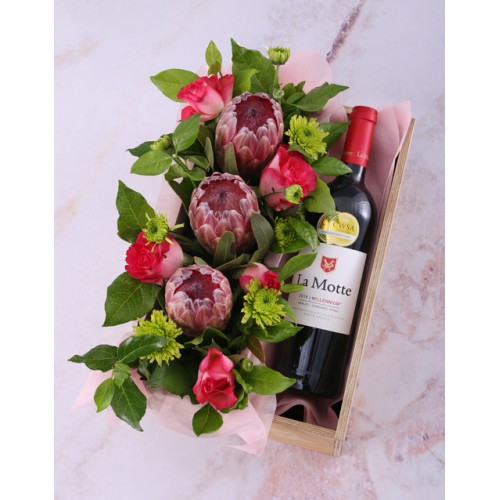 Mixed Proteas And Wine In Crate