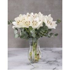 White Asiflorum Lilies In Ribbed Vase