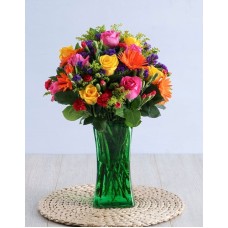 Colourful Blooms In Green Vase