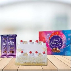Square Pineapple Cake with Assorted Chocolates Combo (1 kg Square Pineapple Cake With Cadbury Celebration and 3 Cadbury Dairy Milk Silk (60 gm))