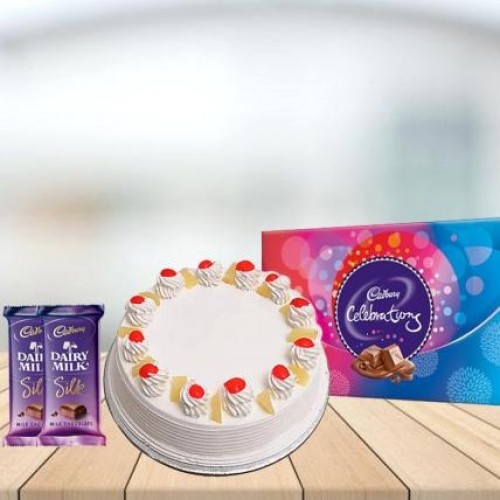 Pineapple Cake with Assorted Chocolates Combo (1/2 kg Pineapple Cake With Cadbury Celebration and 3 Cadbury Dairy Milk Silk (60 gm))