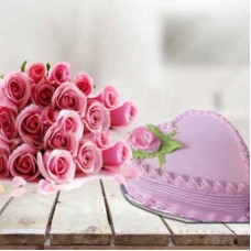 Lovely Pink Combo for Her (1 Kg Heart Shape Strawberry Cake with 12 Pink Roses)