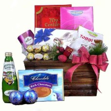 Assorted Chocolates And Juices in a Basket