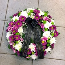 Small wreath in white, lilac and green colors