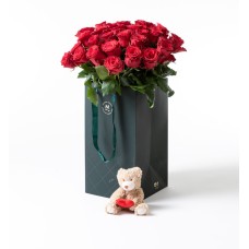 30 red roses in a gift bag with teddy bear