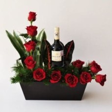 ARRANGEMENT OF 12 HALF-MOON ROSES AND WINE