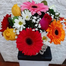 Box with gerberas and roses