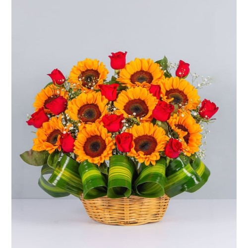 Sunflowers and Red Roses in a Wicker Basket