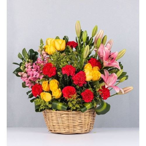 Basket Of Yellow And Pink Carnations