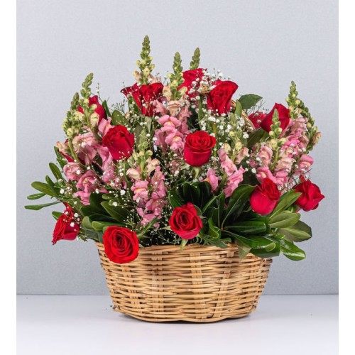 Basket Of Pink Perritos And Red Roses