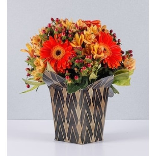 Arrangement of orange Gerberas with Hypericum