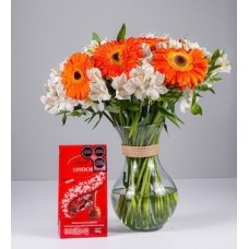 Arrangement of Orange Gerberas, Astromelias and Chocolate Lyndt
