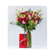 Pink Lily And Daisy In Cylinder With Lindt Reds