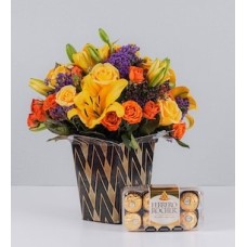 Arrangement of yellow Lilys and Ferrero 16