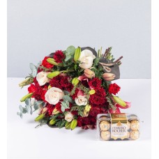Bouquet Of Lily Rosa And Carnations And Ferrero