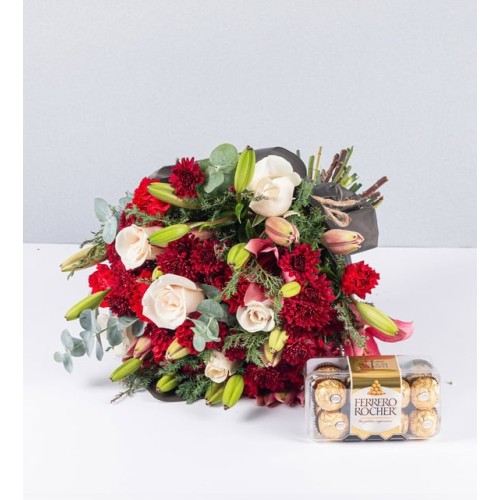 Bouquet Of Lily Rosa And Carnations And Ferrero