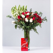 White, Red And Dog Roses In Cylinder With Lindt